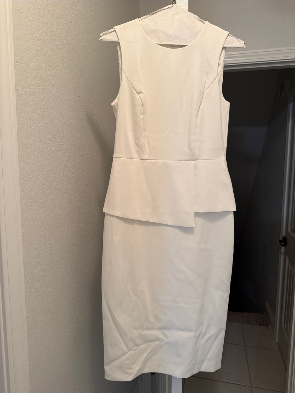 Like New!  Sleeveless White Peplum Sheath Dress